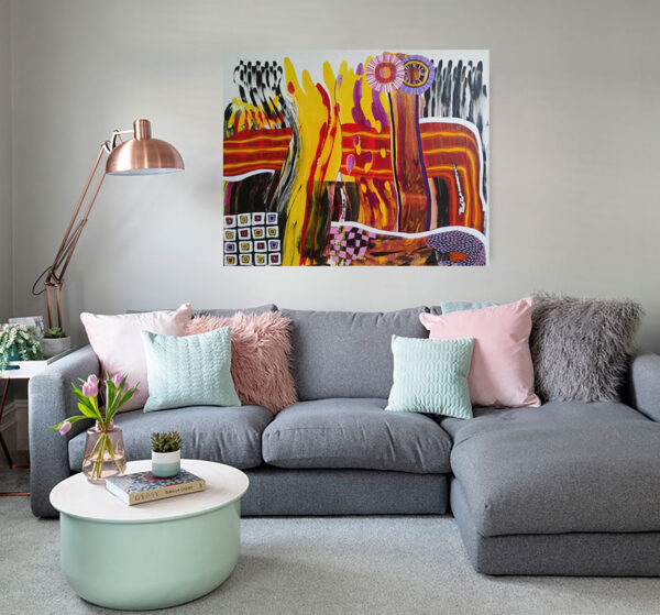 A Splash of Life abstract painting by Yelena Revis above a grey sectional sofa in a modern living room