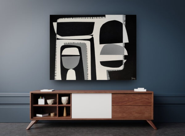 Contrasts II by Yelena Revis hanging above a walnut sideboard against a dark blue wall