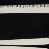 Close-up of black and off-white forms in Contrasts II with a fringe of fine stitched marks along the edge