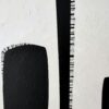 Detail of stitched hatch-mark lines beside textured black paint in Contrasts by Yelena Revis