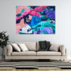 Dance of Blues abstract painting by Yelena Revis on a light wall above a beige couch
