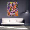 Euphoric Whirlwind abstract painting by Yelena Revis above a white sofa in a modern living room