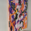 Side view of Euphoric Whirlwind by Yelena Revis above a wooden console table