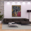 Fractured Monolith Wall Art Room Mockup – Abstract Painting by Yelena Revis Fractured Monolith abstract painting by Yelena Revis above a dark brown sectional sofa in a living room
