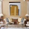 Highrises Interior Wall Art Mockup – Abstract Painting by Yelena Revis Highrises geometric abstract painting by Yelena Revis above a beige sofa in an elegant living room