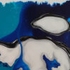 Detail of an oval white cell with glossy black borders over sapphire and turquoise washes in New Beginning by Yelena Revis