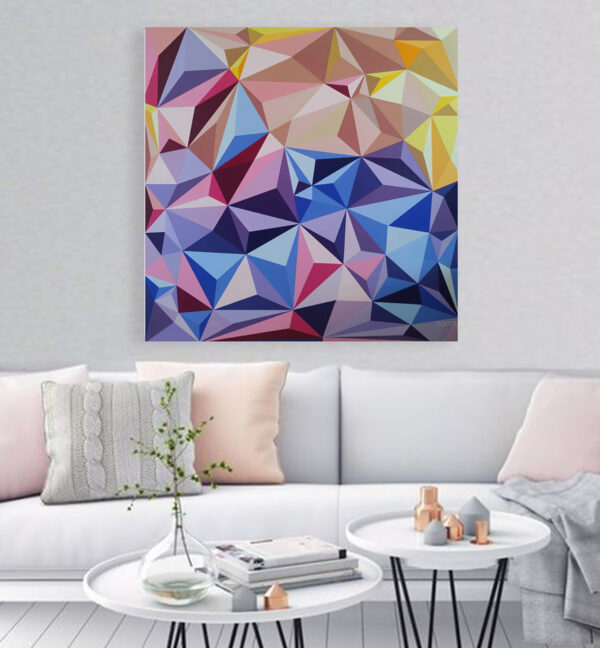 Sun Glare by the Sea abstract painting by Yelena Revis above a white sofa with pastel cushions