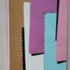 Tenderness Side Angle Profile View – Stretched Canvas Painting by Yelena Revis Side view of Tenderness by Yelena Revis showing pink painted gallery edges above a wooden tabletop