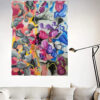 Travelling Through the Unknown abstract painting by Yelena Revis above a light grey sofa in a living room
